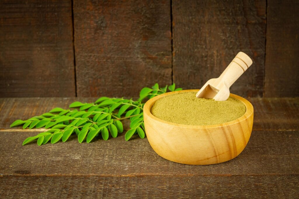 moringa, powder, leaves, nature, moringa oleifera, super food, healthy, vitamins, herbal, supplement, organic, wooden bowl, rustic, closeup